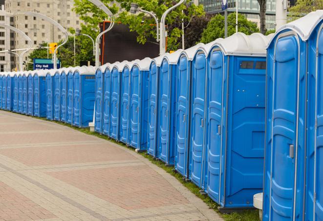 a row of portable restrooms at an outdoor special event, ready for use in Garden Grove, CA